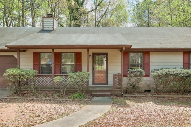 798 Tommy Lee Cook Rd, Palmetto, GA 30268 - single story home with a porch, an attached garage, a chimney, and a shingled roof