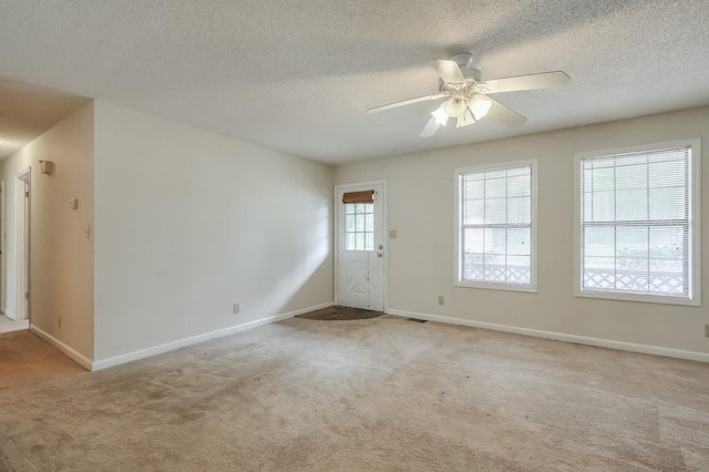 798 Tommy Lee Cook Rd, Palmetto, GA 30268 - foyer with light colored carpet, ceiling fan, and a textured ceiling