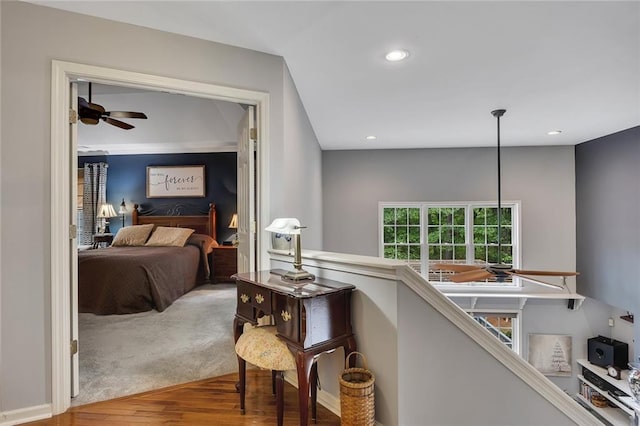 hall featuring recessed lighting and wood finished floors