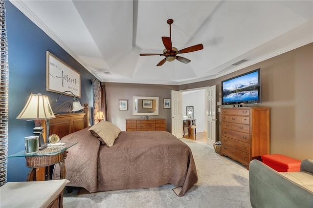 carpeted bedroom featuring crown molding, a raised ceiling, a ceiling fan, and visible vents