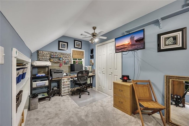 carpeted office with ceiling fan, vaulted ceiling, and visible vents