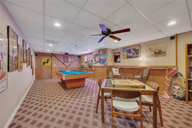 rec room with billiards, a paneled ceiling, carpet flooring, and wood walls