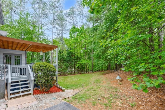 view of yard featuring a wooden deck