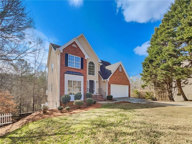 traditional-style house with brick siding, a front lawn, fence, a garage, and driveway