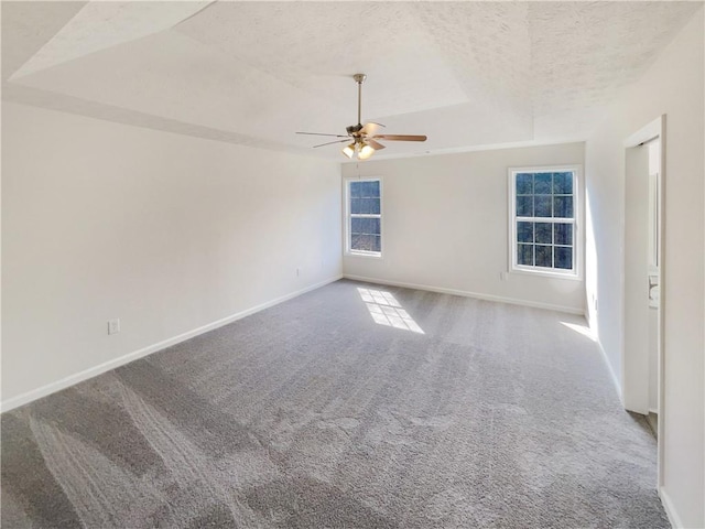 unfurnished room with baseboards, carpet floors, a textured ceiling, and ceiling fan