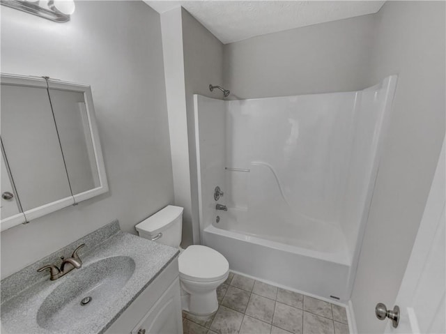 bathroom with tile patterned floors, toilet, shower / bathtub combination, a textured ceiling, and vanity