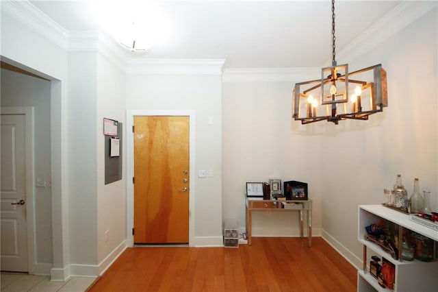 hallway with hardwood / wood-style floors, a notable chandelier, and crown molding