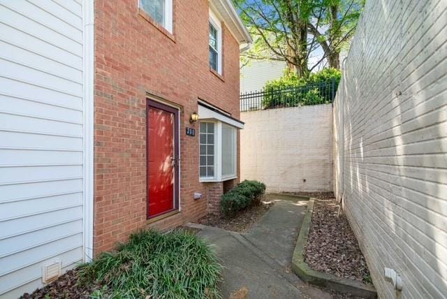 200 High Creek Dr, Roswell, GA 30076 - view of exterior entry with brick siding and fence