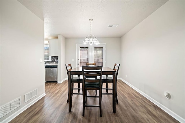 200 High Creek Dr, Roswell, GA 30076 - dining area with dark wood-type flooring, visible vents, baseboards, and a notable chandelier