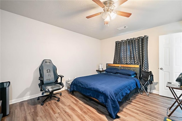 200 High Creek Dr, Roswell, GA 30076 - bedroom with wood finished floors, baseboards, a ceiling fan, and visible vents