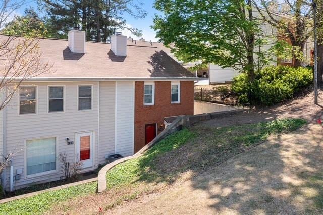 200 High Creek Dr, Roswell, GA 30076 - back of house featuring fence and a chimney