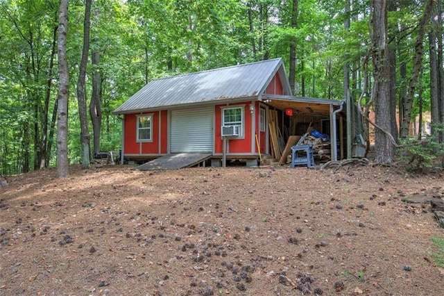 view of outbuilding with cooling unit