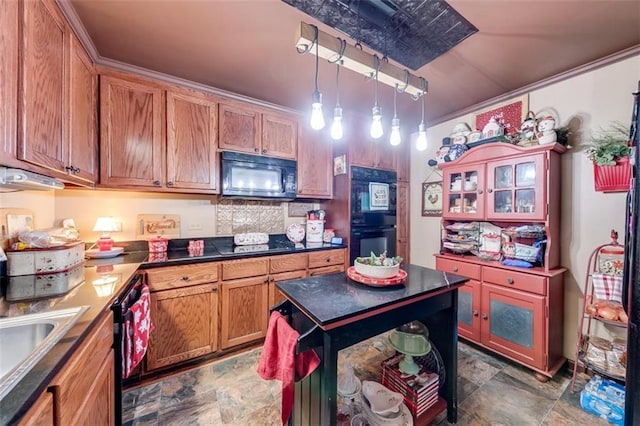 kitchen with sink, crown molding, backsplash, black appliances, and decorative light fixtures