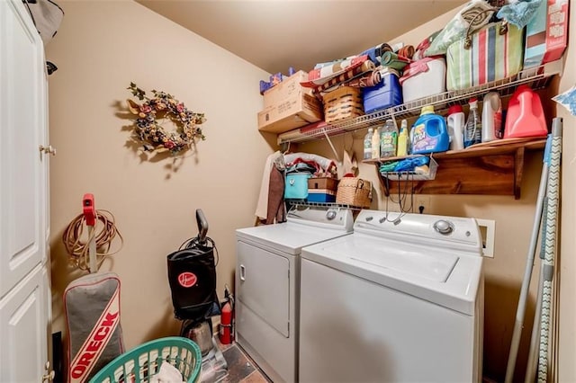 laundry area with washing machine and dryer