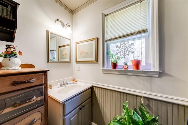 bathroom featuring vanity and ornamental molding