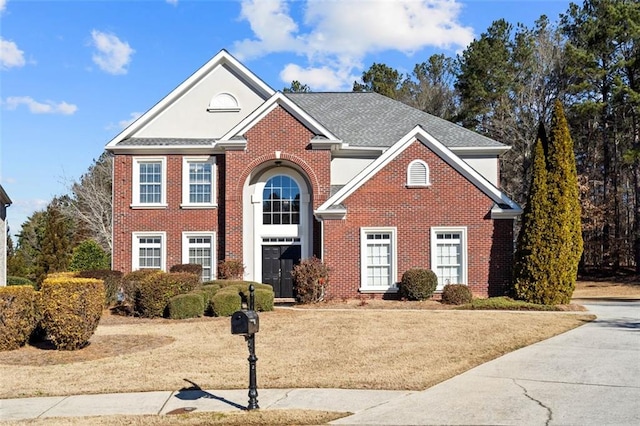 front facade featuring a front yard