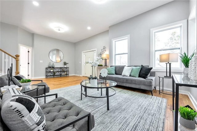 living room with hardwood / wood-style floors and plenty of natural light