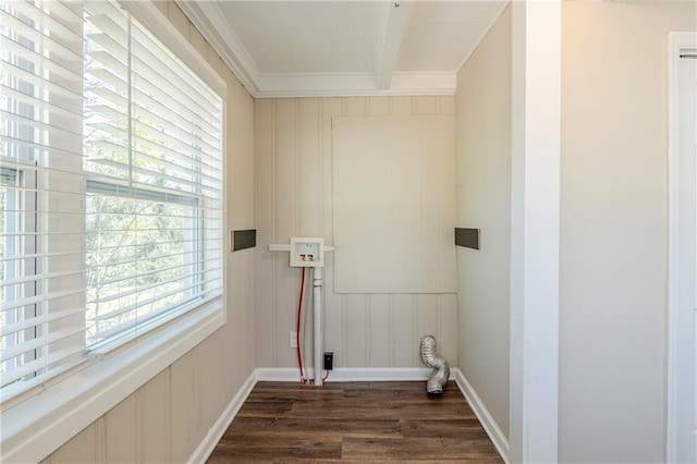 clothes washing area featuring dark wood finished floors, laundry area, baseboards, and ornamental molding