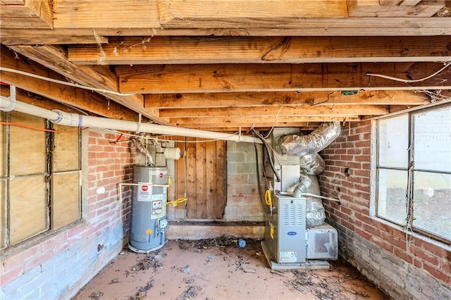 basement with water heater and brick wall