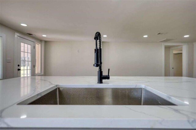 kitchen featuring tasteful backsplash, appliances with stainless steel finishes, light hardwood / wood-style flooring, and gray cabinetry