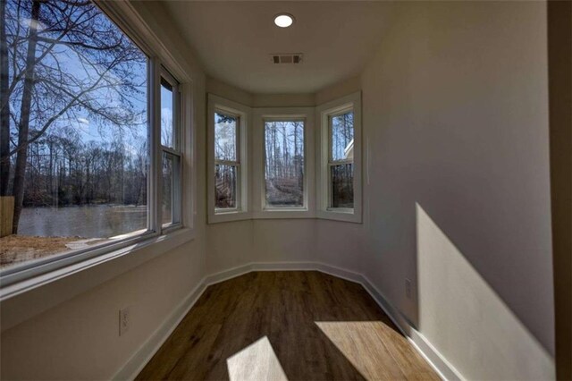 bedroom featuring wood-type flooring and ceiling fan