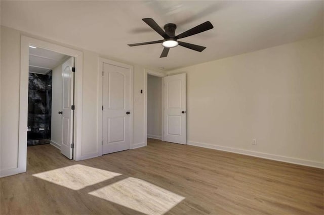 bathroom featuring vanity, hardwood / wood-style floors, toilet, and an enclosed shower