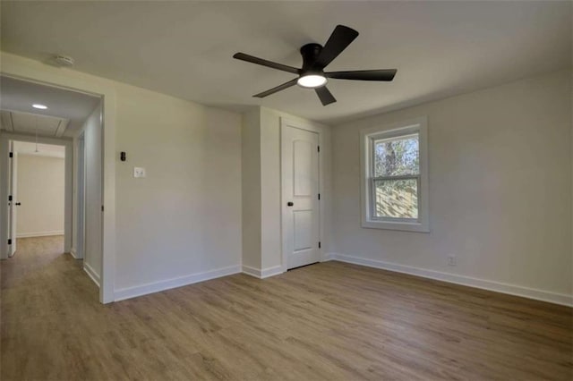 bathroom featuring vanity, toilet, a shower with shower door, and hardwood / wood-style floors