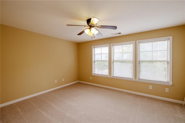 4400 Village Field Pl, Suwanee, GA 30024 - empty room with light colored carpet, a ceiling fan, healthy amount of natural light, and baseboards