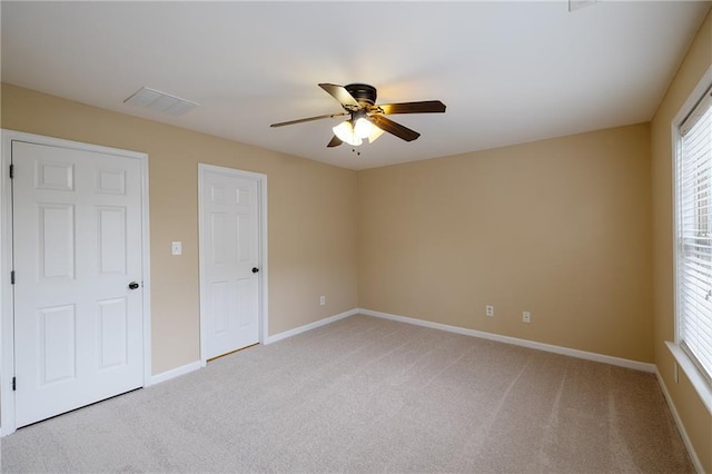 4400 Village Field Pl, Suwanee, GA 30024 - unfurnished bedroom with light carpet, baseboards, and ceiling fan