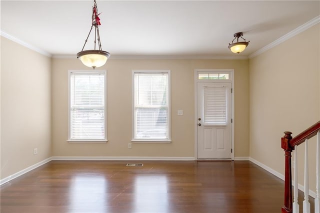 4400 Village Field Pl, Suwanee, GA 30024 - foyer featuring healthy amount of natural light, wood finished floors, ornamental molding, and baseboards