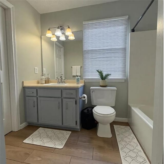 full bathroom featuring vanity, toilet, and shower / bathing tub combination