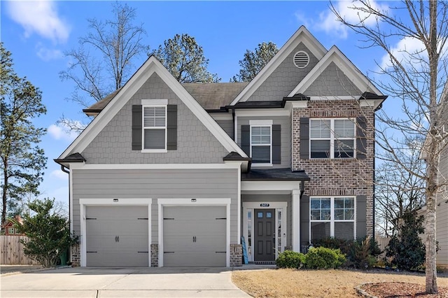 craftsman house with driveway and an attached garage