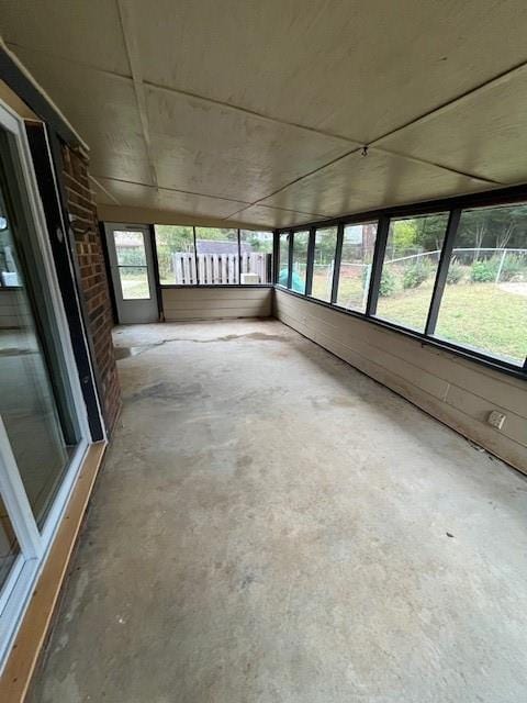 unfurnished sunroom with a wealth of natural light