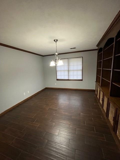 unfurnished room with a notable chandelier, dark hardwood / wood-style floors, and ornamental molding