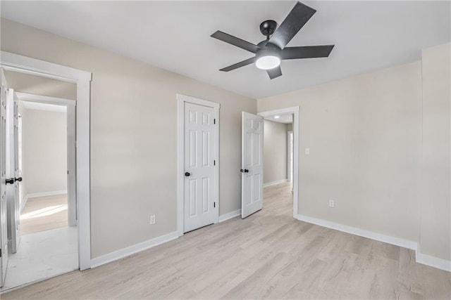 unfurnished bedroom featuring ceiling fan and light wood-type flooring