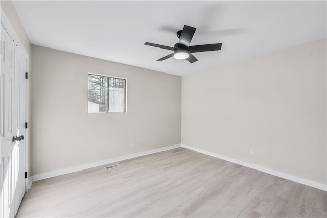 unfurnished room featuring ceiling fan and light hardwood / wood-style flooring