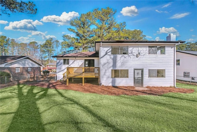 back of house with a yard and a deck