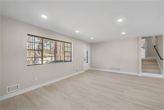 spare room with light hardwood / wood-style floors