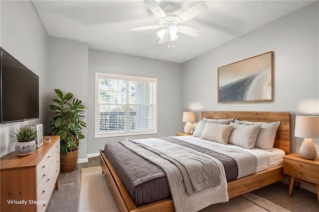 bedroom featuring ceiling fan and hardwood / wood-style floors