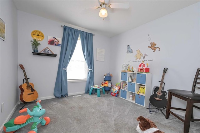 rec room with baseboards, carpet, ceiling fan, and visible vents