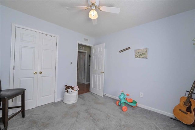 unfurnished bedroom with visible vents, carpet flooring, baseboards, and a closet
