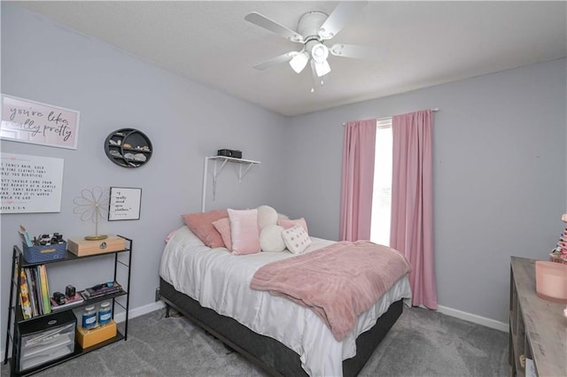 bedroom with baseboards, a ceiling fan, and carpet