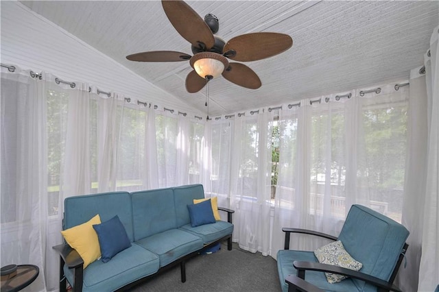 sunroom / solarium featuring an outdoor living space, ceiling fan, carpet flooring, and lofted ceiling