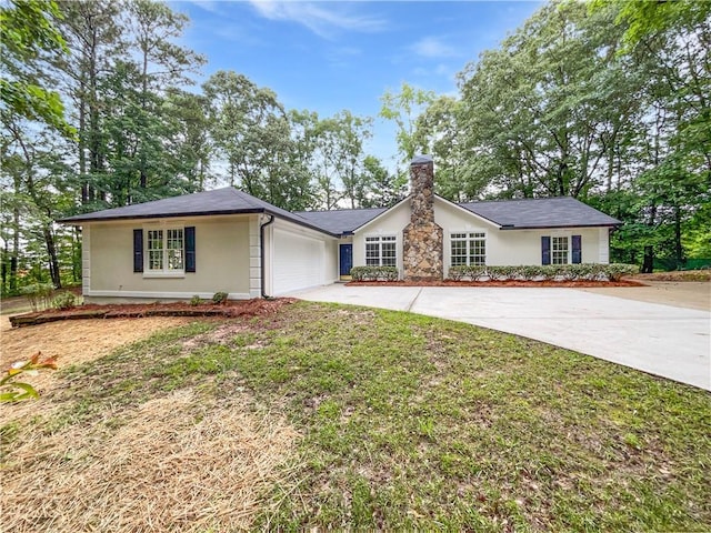 2734 Amber Springs Way, Buford, GA 30519 - single story home with driveway, a chimney, a garage, and stucco siding