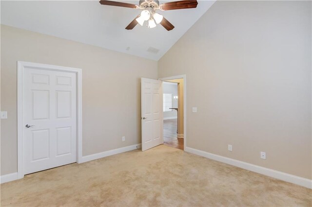 4321 Lanier Ridge Walk Unit 1704, Cumming, GA 30041 - unfurnished bedroom featuring baseboards, a ceiling fan, high vaulted ceiling, and light colored carpet