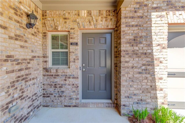 4321 Lanier Ridge Walk Unit 1704, Cumming, GA 30041 - property entrance featuring stone siding, a porch, and brick siding