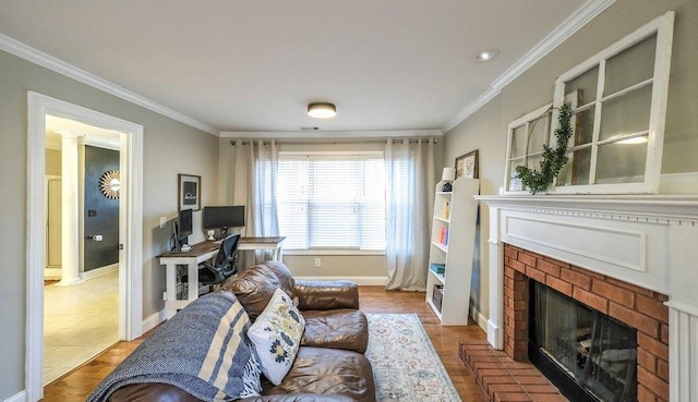 living room with baseboards, a brick fireplace, wood finished floors, and crown molding
