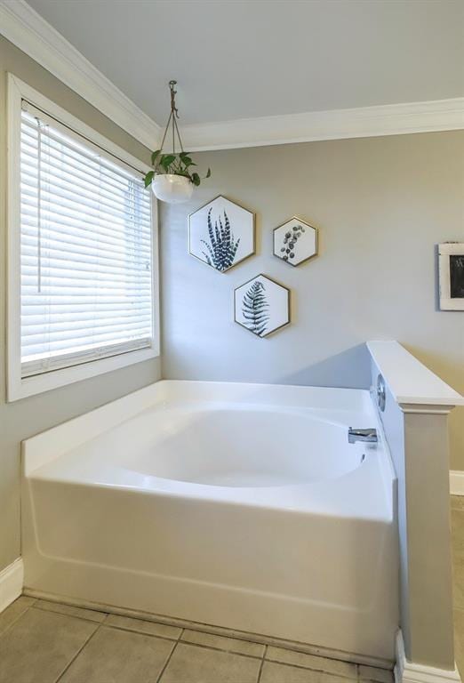 bathroom featuring a bath, tile patterned flooring, and crown molding