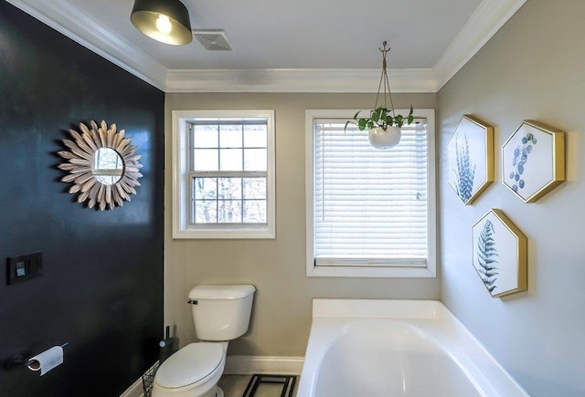 bathroom with toilet, visible vents, baseboards, ornamental molding, and a bath