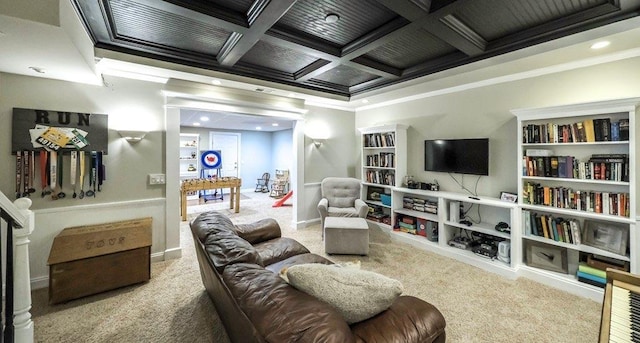 sitting room featuring beam ceiling, ornamental molding, carpet flooring, coffered ceiling, and baseboards